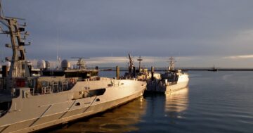 A photo of Austal ships in a clear water setting