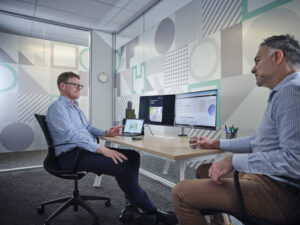 Two people talking about Sustainable Specification
