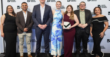 Capral's team taking a photo with trophy at the good design awards