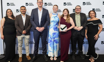 Capral's team taking a photo with trophy at the good design awards